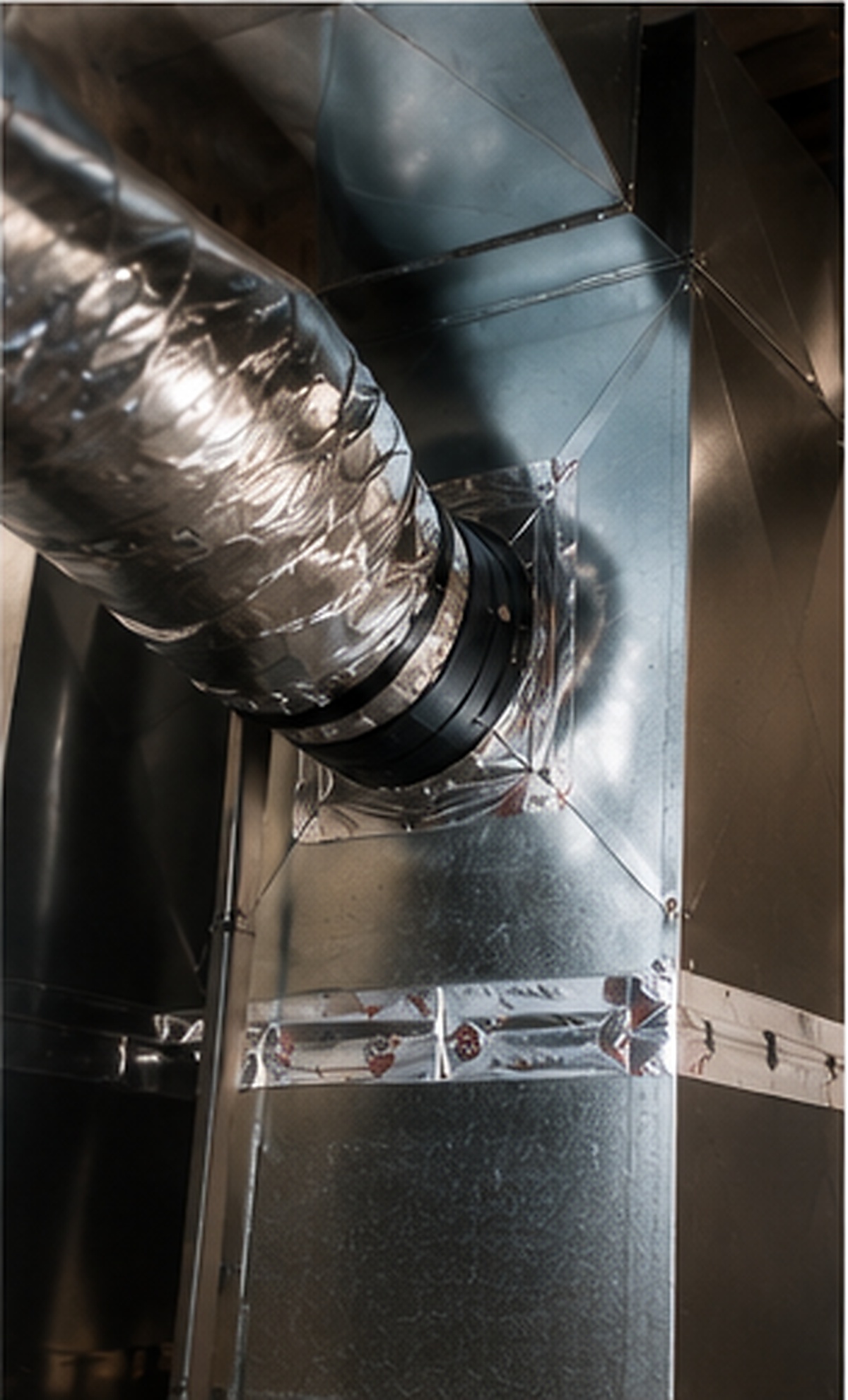 Sheet metal plenum with an insulated flex duct takeoff and sealed seams.
